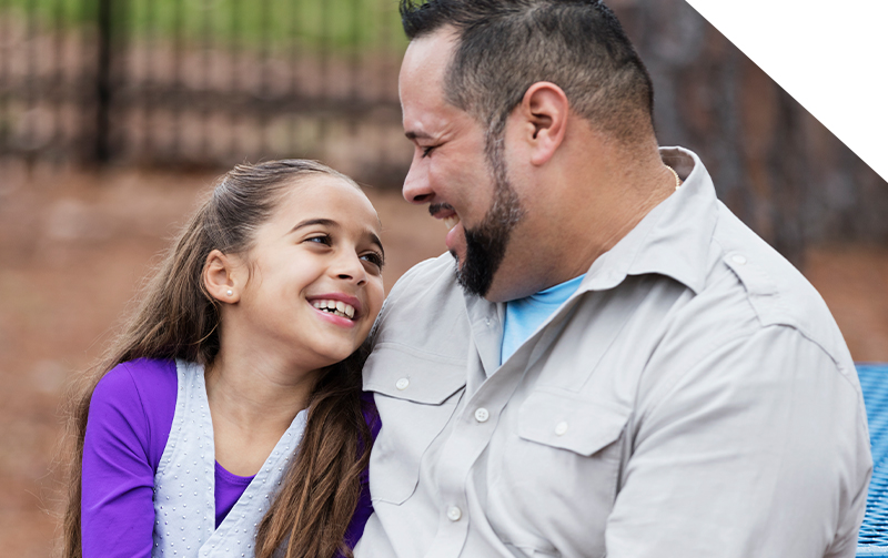 father looking into his daughter's eyes