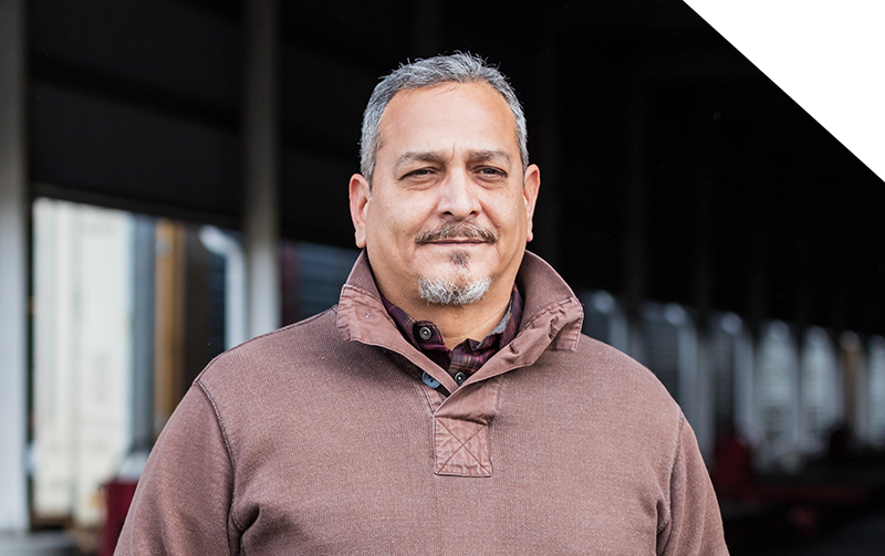 Man smiling at a work site