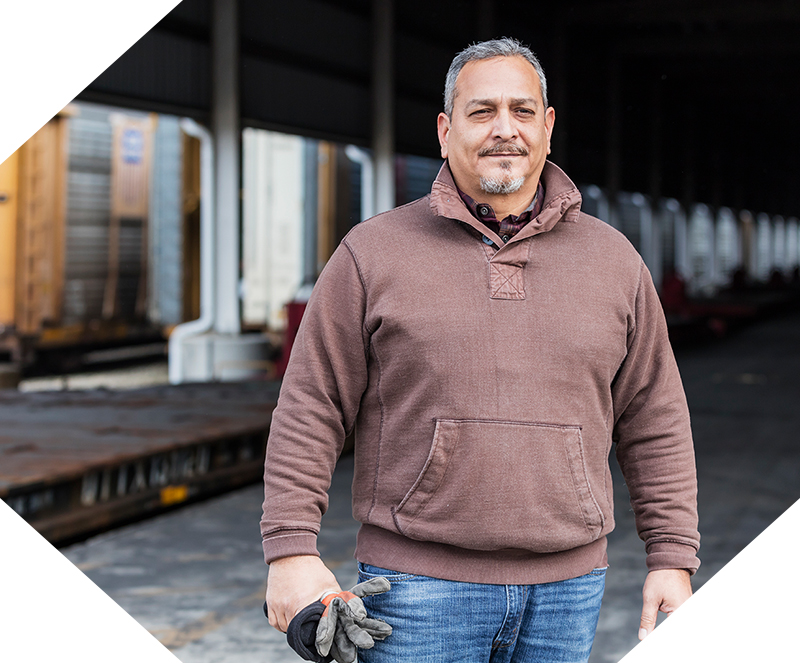 Man smiling at a work site